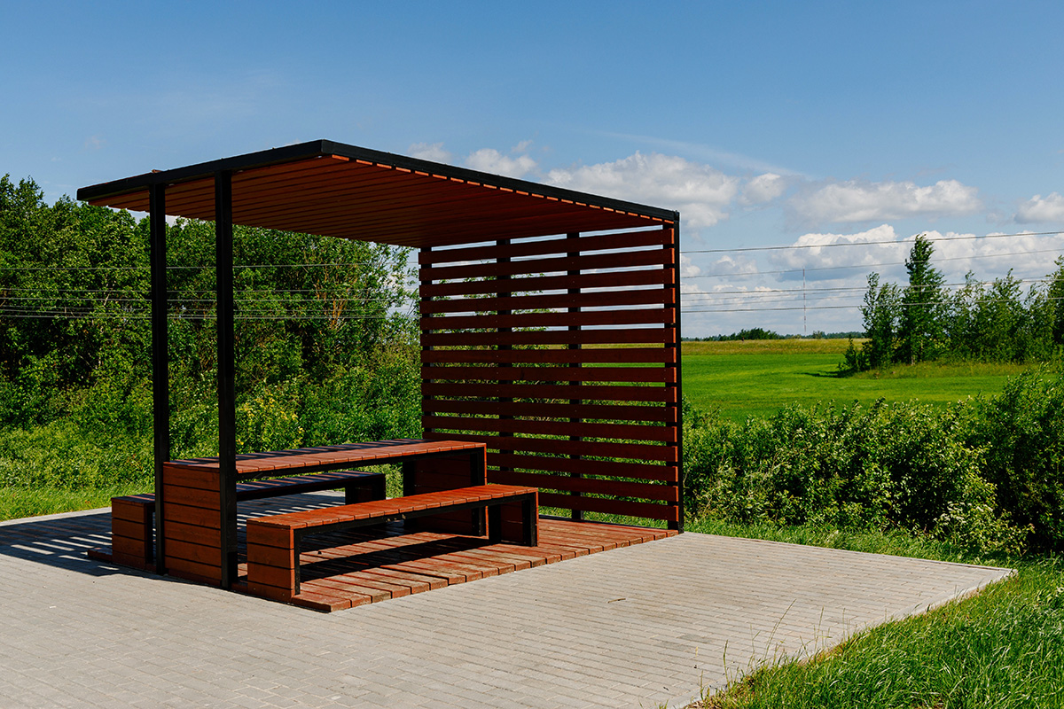 Wooden shelter or hut in the park with bench park